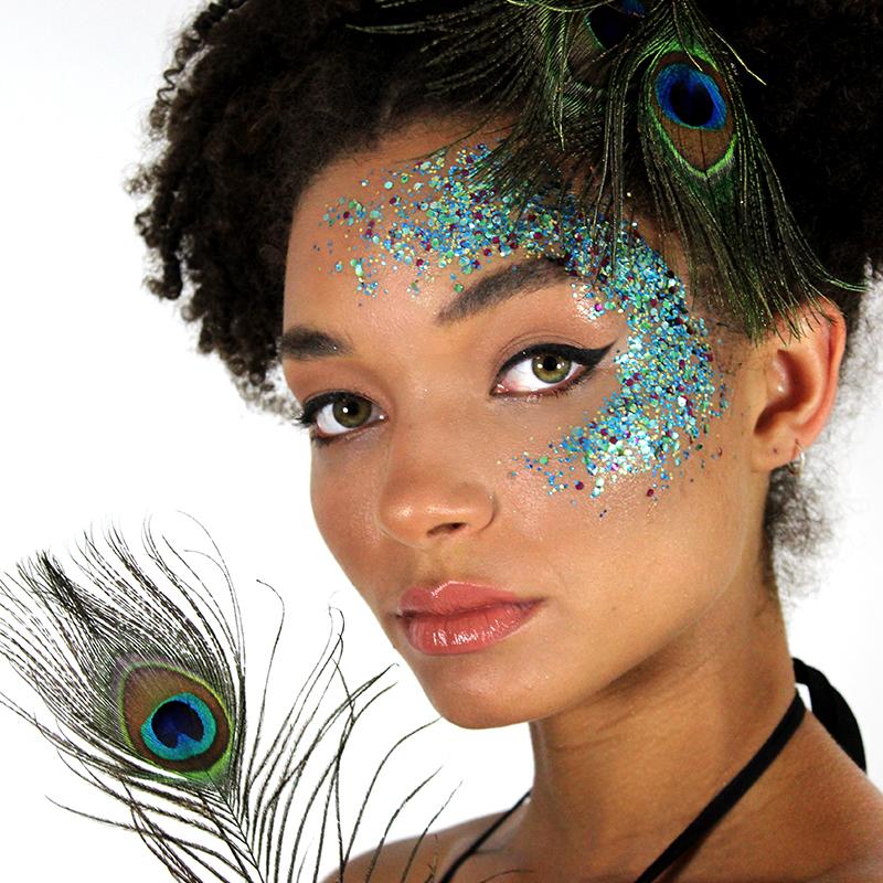 EcoStardust Biodegradable Glitter Peacock tin with blue green glitter. Vegan and cruelty free. Perfect for festival season