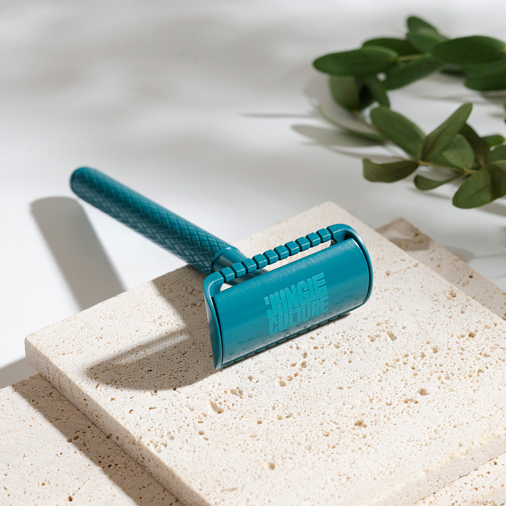 
                  
                    diamond grip teal reusable razor on travertine
                  
                