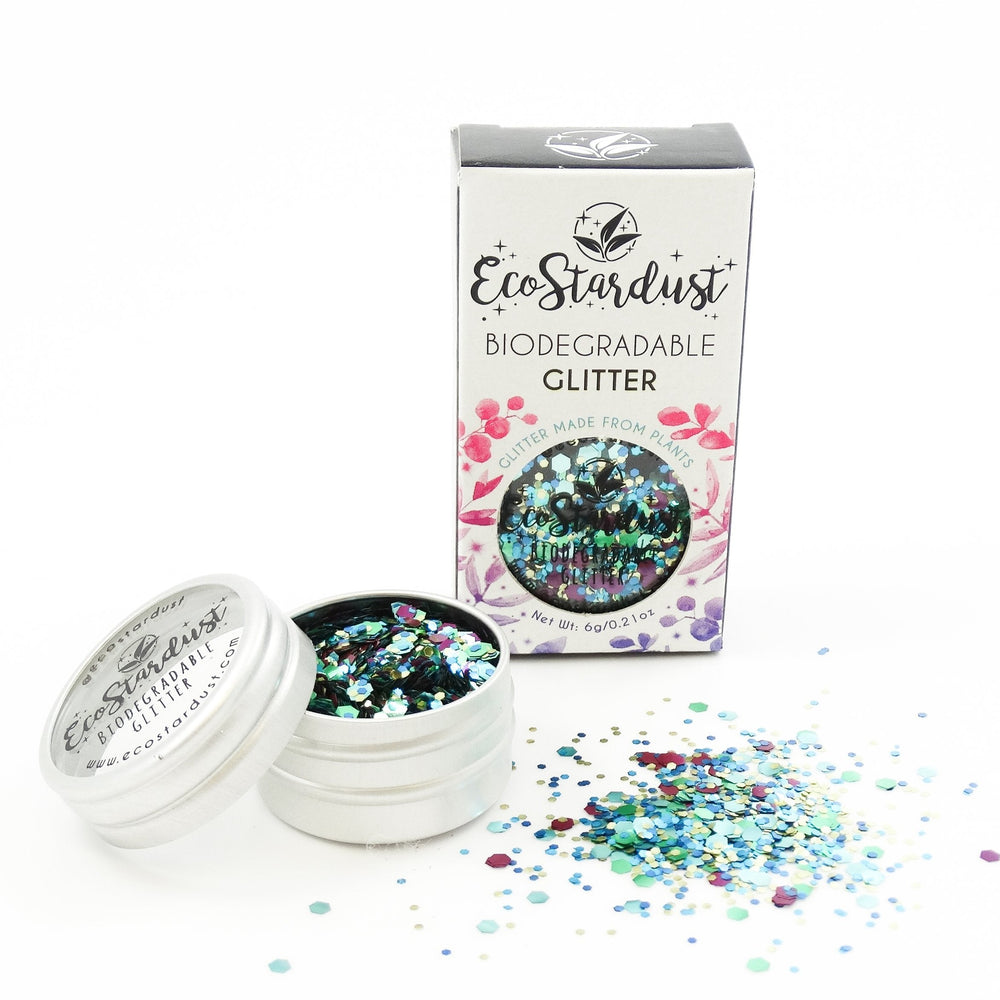 EcoStardust Biodegradable Glitter Peacock tin with blue green glitter. Vegan and cruelty free. Perfect for festival season 
